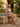 Grandma's Tiles one-piece swimsuit at a Havana courtyard fountain in dappled golden light — House of Yas editorial
