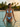 Cuban Paradise string bikini standing in a turquoise sea at golden hour — House of Yas editorial