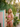 Miami Elephant string bikini in a tropical Miami garden beside a pastel Art Deco wall — House of Yas editorial