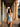 Calle Habana Blue swimsuit beneath a blue colonial arcade in Old Havana — House of Yas editorial